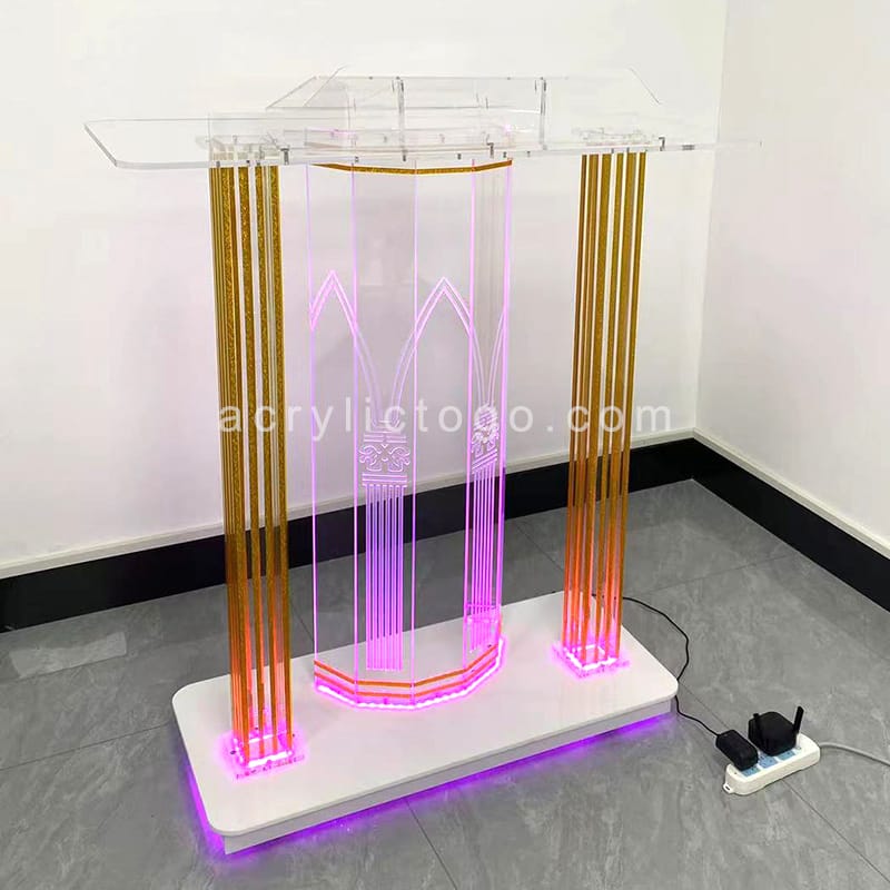 Acrylic LED church lectern with gold decorative columns and RGB color-changing base lighting