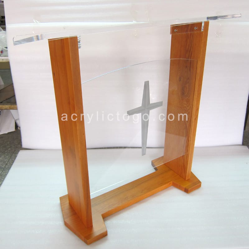 Clear acrylic panel with engraved cross mounted on solid wood pillar church lectern, side view