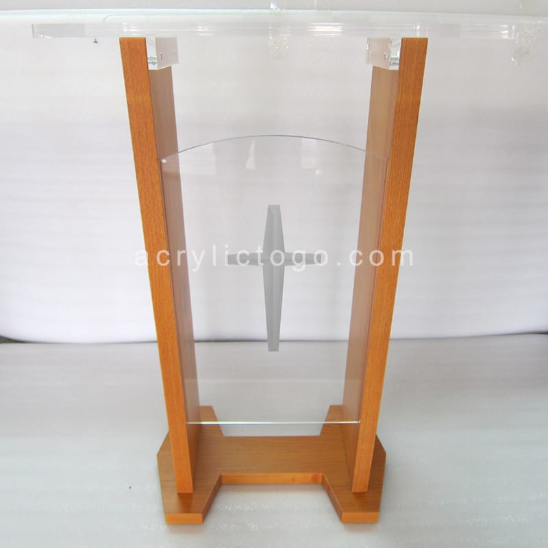 Clear acrylic church lectern with wood H-frame and laser engraved cross, front view