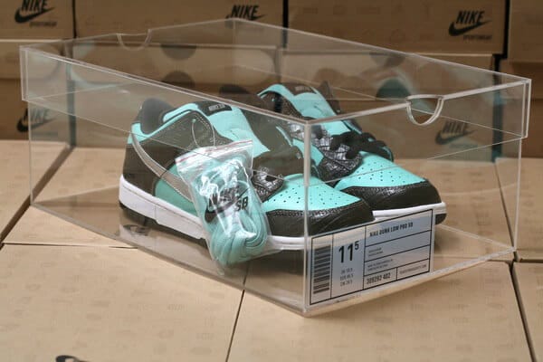 Nike SB sneaker inside custom acrylic shoe box used as premium retail packaging — bulk OEM order 200 units for online sneaker retailer