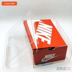 Custom acrylic sneaker display case with lid open at angle, showing Nike shoebox fit inside clear case — OEM manufacturer