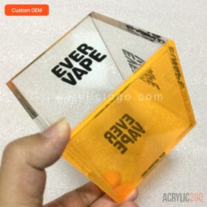 Inverted view of custom OEM acrylic vape display box showing thick fluorescent orange base and UV-printed side panels – ACRYLIC2GO