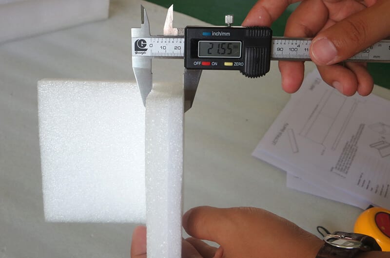 Quality control inspection of acrylic products during OEM manufacturing.