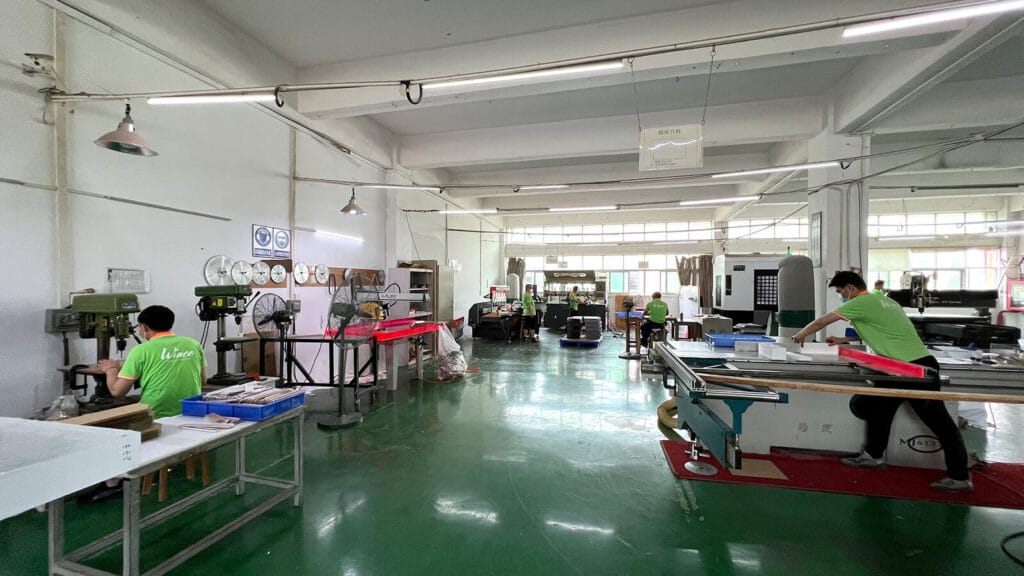 Acrylic manufacturing workshop in Shenzhen featuring CNC routing, diamond polishing, and saw cutting, operated by ACRYLIC2GO.