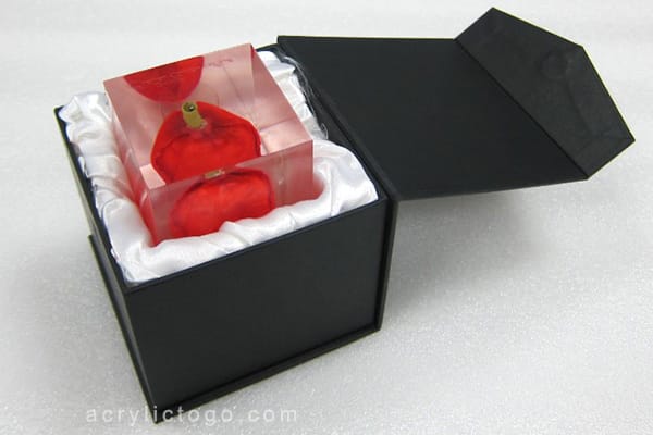 Acrylic tulip paperweight in a satin-lined black gift box, shown as a packaging reference