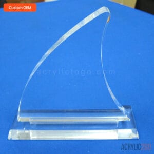Custom curved wave acrylic trophy showing CNC-routed blade and polished base, side angle view