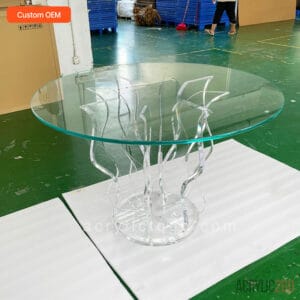 Custom acrylic wave-base dining table with round tempered glass top, hand-carved sculptural pedestal