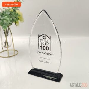 Custom flame-shaped acrylic award with a symmetric tapered point, mounted on a rectangular black base