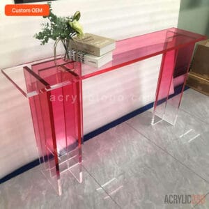 Custom translucent pink acrylic console table with gradient tabletop and asymmetric panel legs