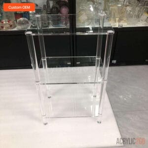 Front view of three-tier acrylic bookshelf with round acrylic legs for display or storage use