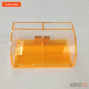 Fluorescent amber acrylic jewelry organizer with a curved corner and multi-compartment tray, front view
