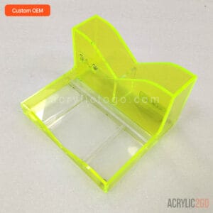 Angled view of acrylic makeup organizer showing the wave-shaped brush compartments and tray base