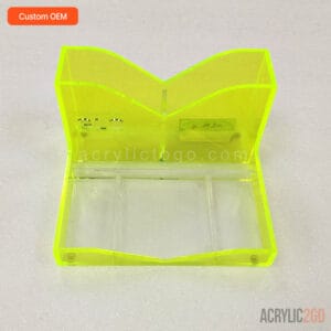 Fluorescent yellow-green acrylic makeup organizer with a wave-shaped brush holder and tray base, front view