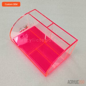 Angled view of multi-compartment acrylic desk caddy showing its curved corner and interior compartments