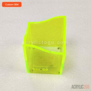 Front view of acrylic pen organizer showing the wavy rim silhouette against a flat back panel