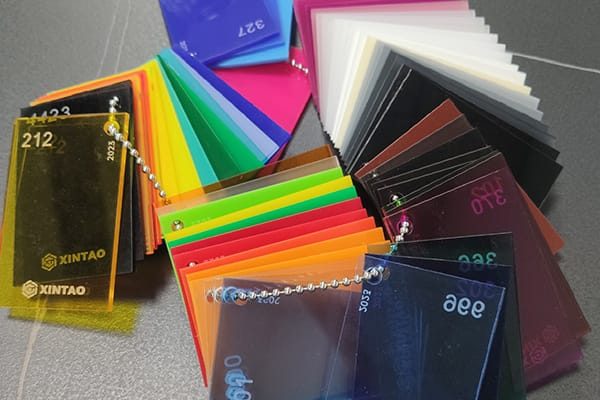 Fan of colored acrylic sheet swatches used for selecting custom color options